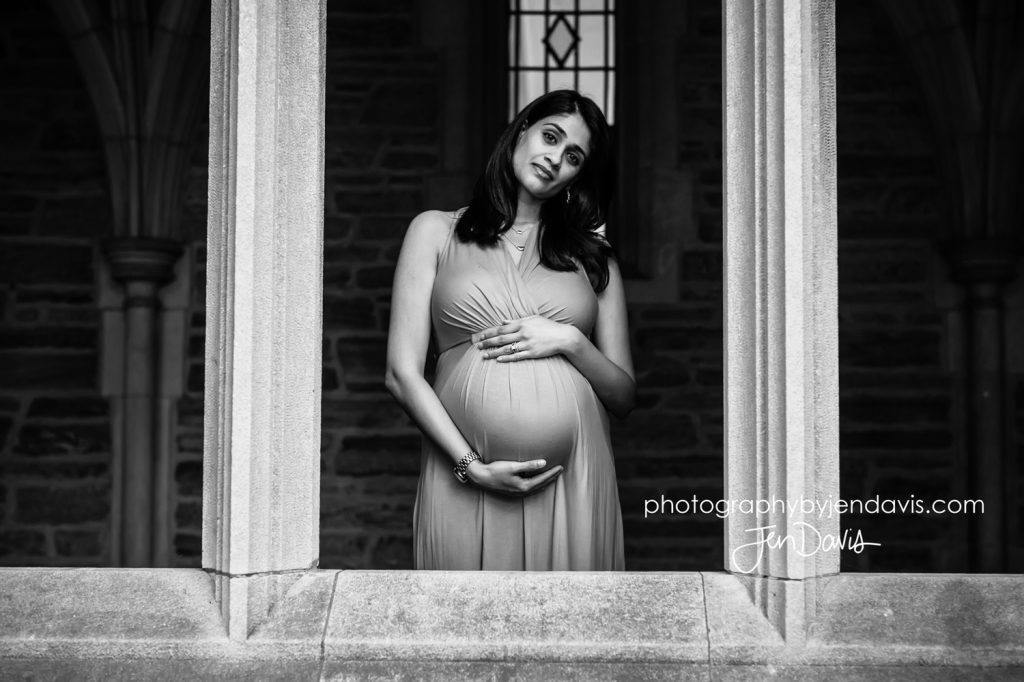 Pregnant woman in a window in black and white