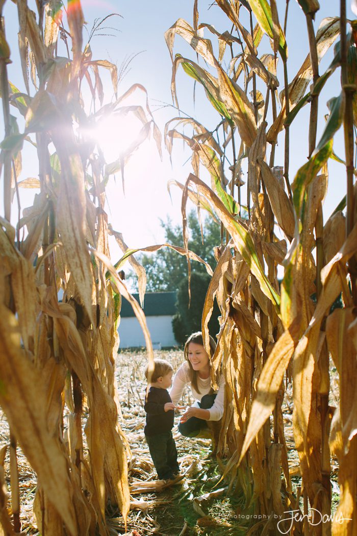 a mom and son hug in the corn field maze at windsor farms in the fall in nj