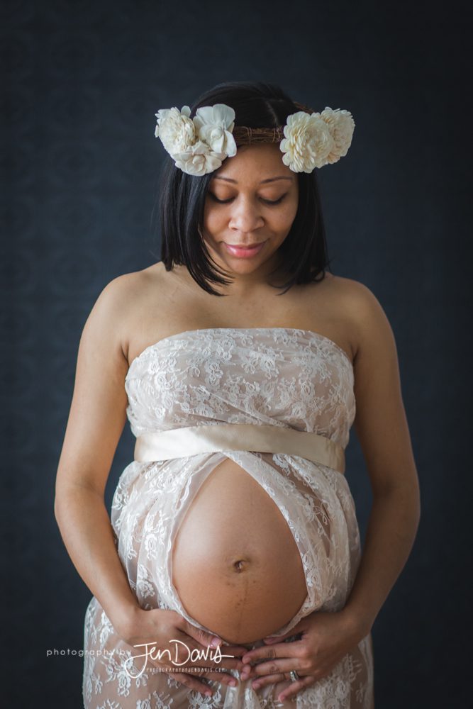 pregnant woman in lace and flower headpiece