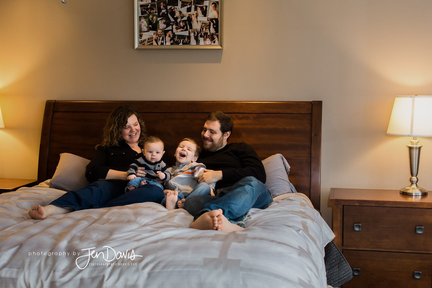 family on a bed at home laughing