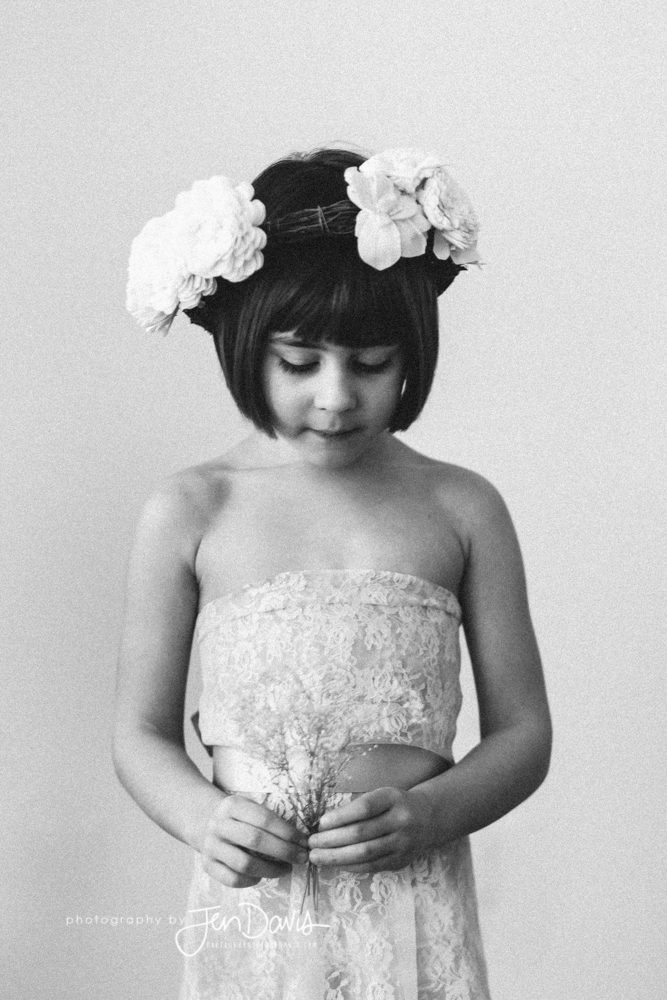 Black and White Film Little Girl holding flowers