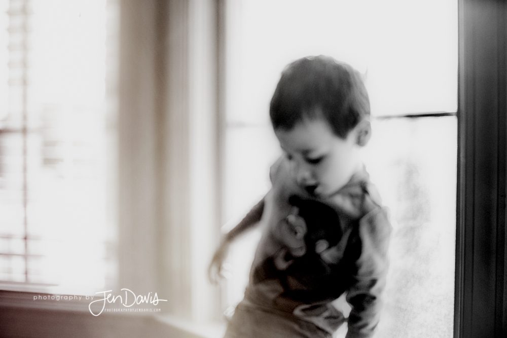 black and white out of focus of little boy