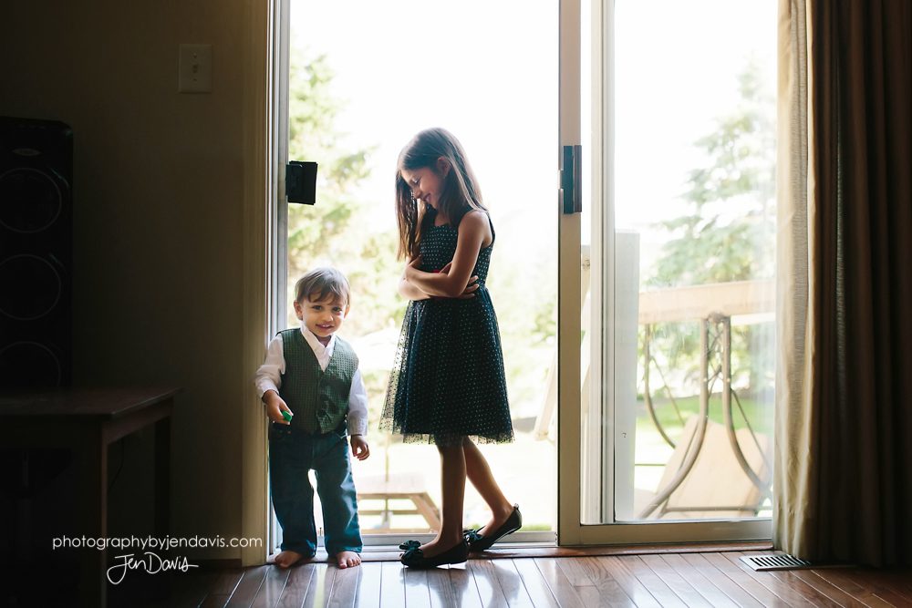 brother and sister sliding glass door in their home