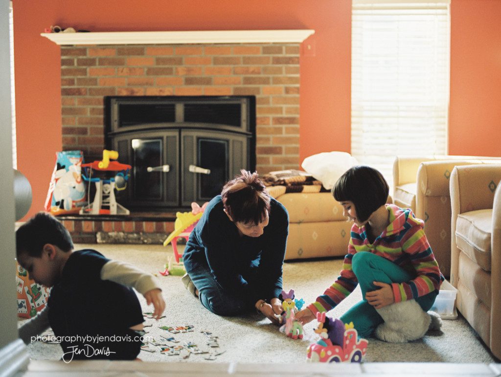 children playing legos on the floor