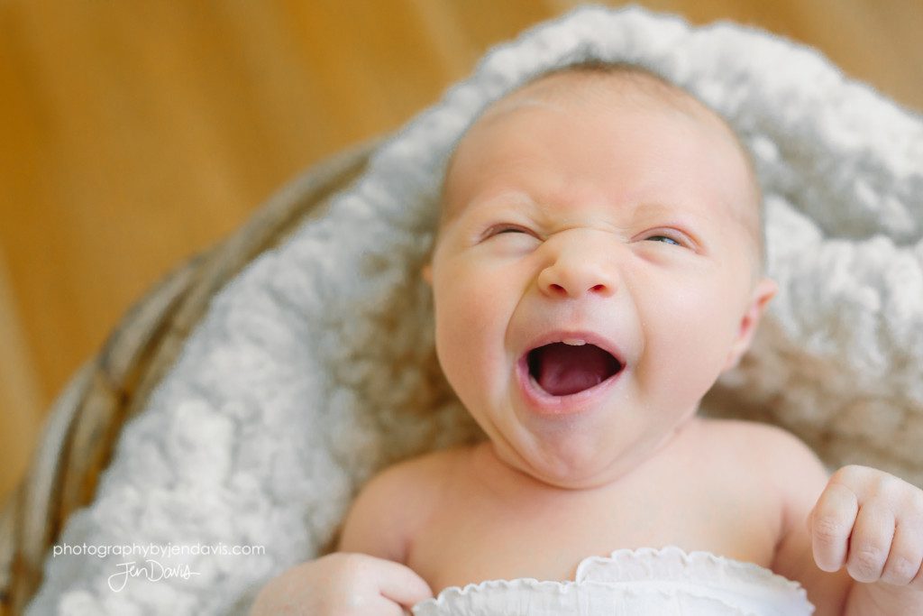 baby girl yawning at camera