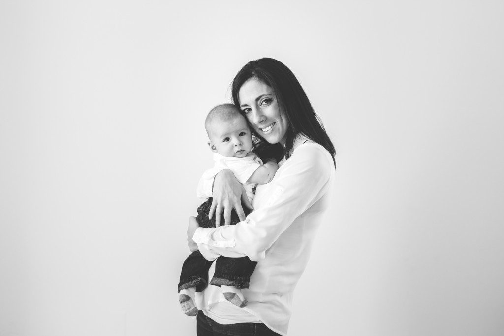 black and white image of baby with mommy