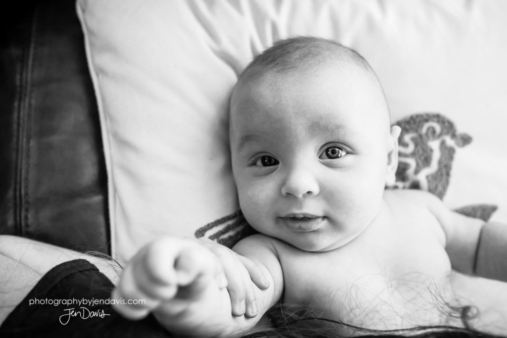 black and white of baby looking at camera
