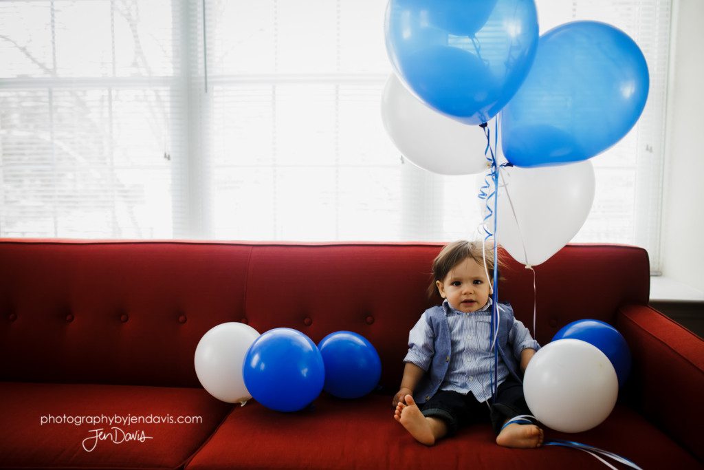one year old boy with balloons