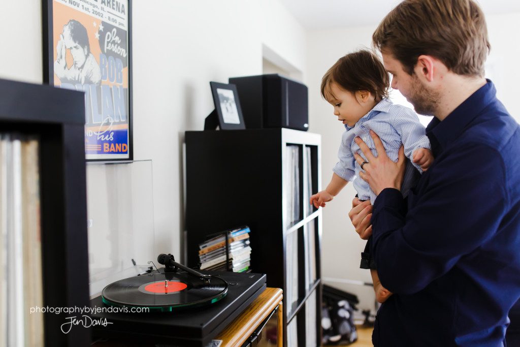 1 year old boy looking at record player
