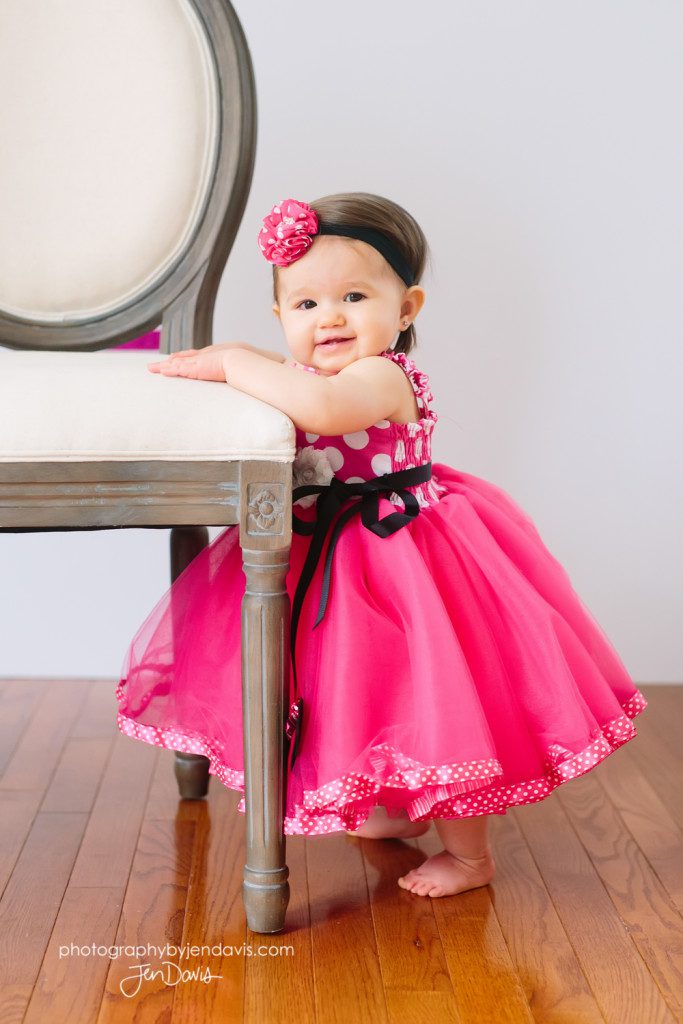 One year old party dress with chair