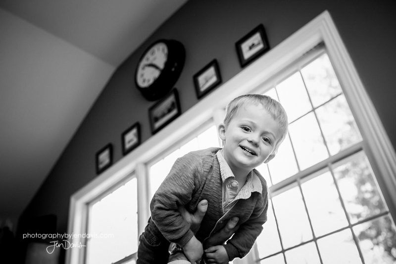 black and white of little boy doing airplane