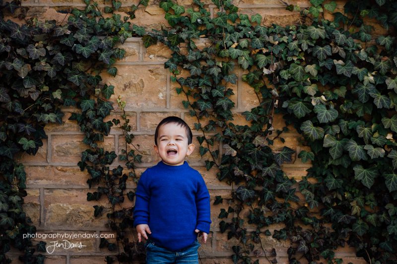 6 year old boy smiling in the ivy in princeton