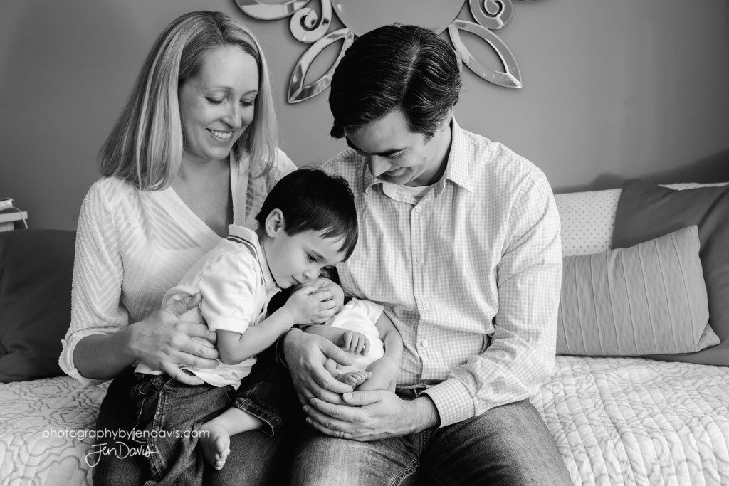 Family in nursery in black and white