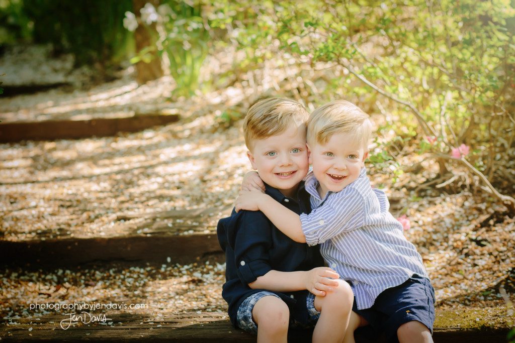 Little boys in the garden hugging