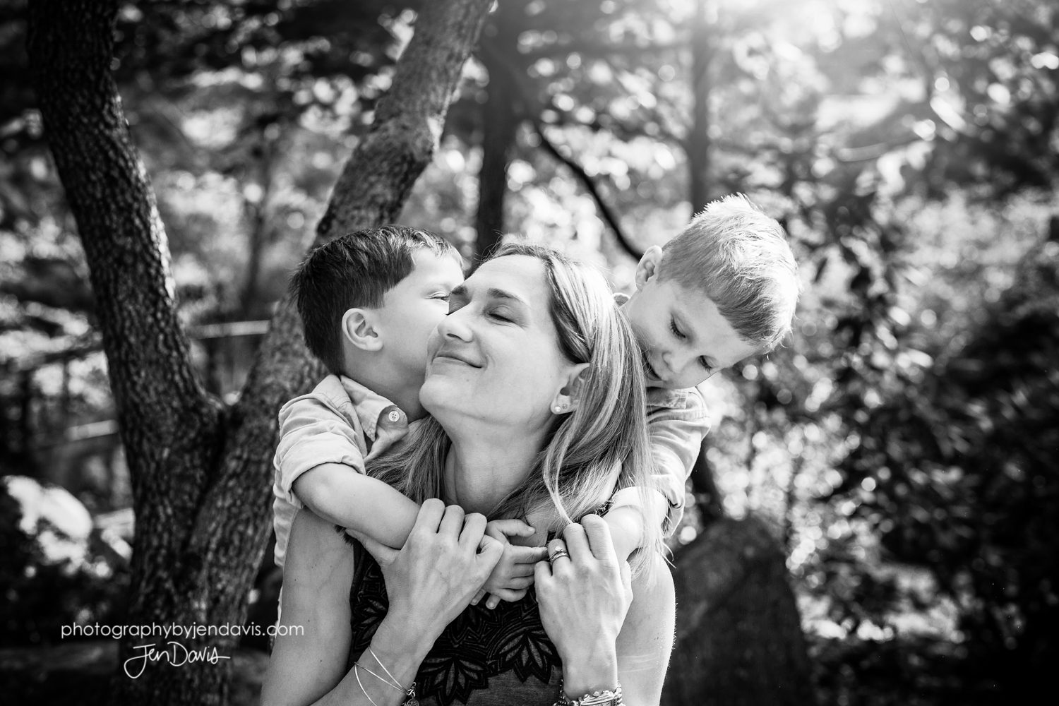 black and white of mom with twin boys
