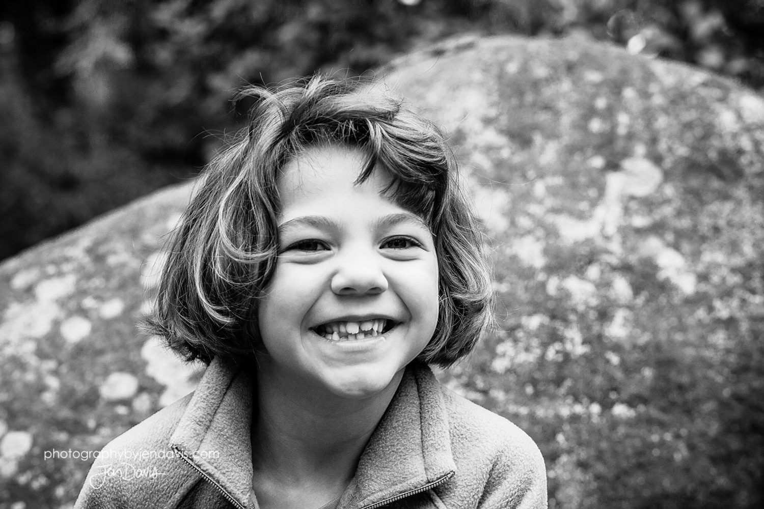black and white of 8 year old girl smiling