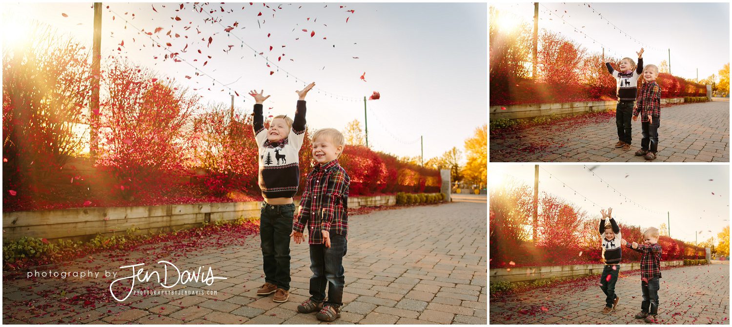 Little boys throwing leaves