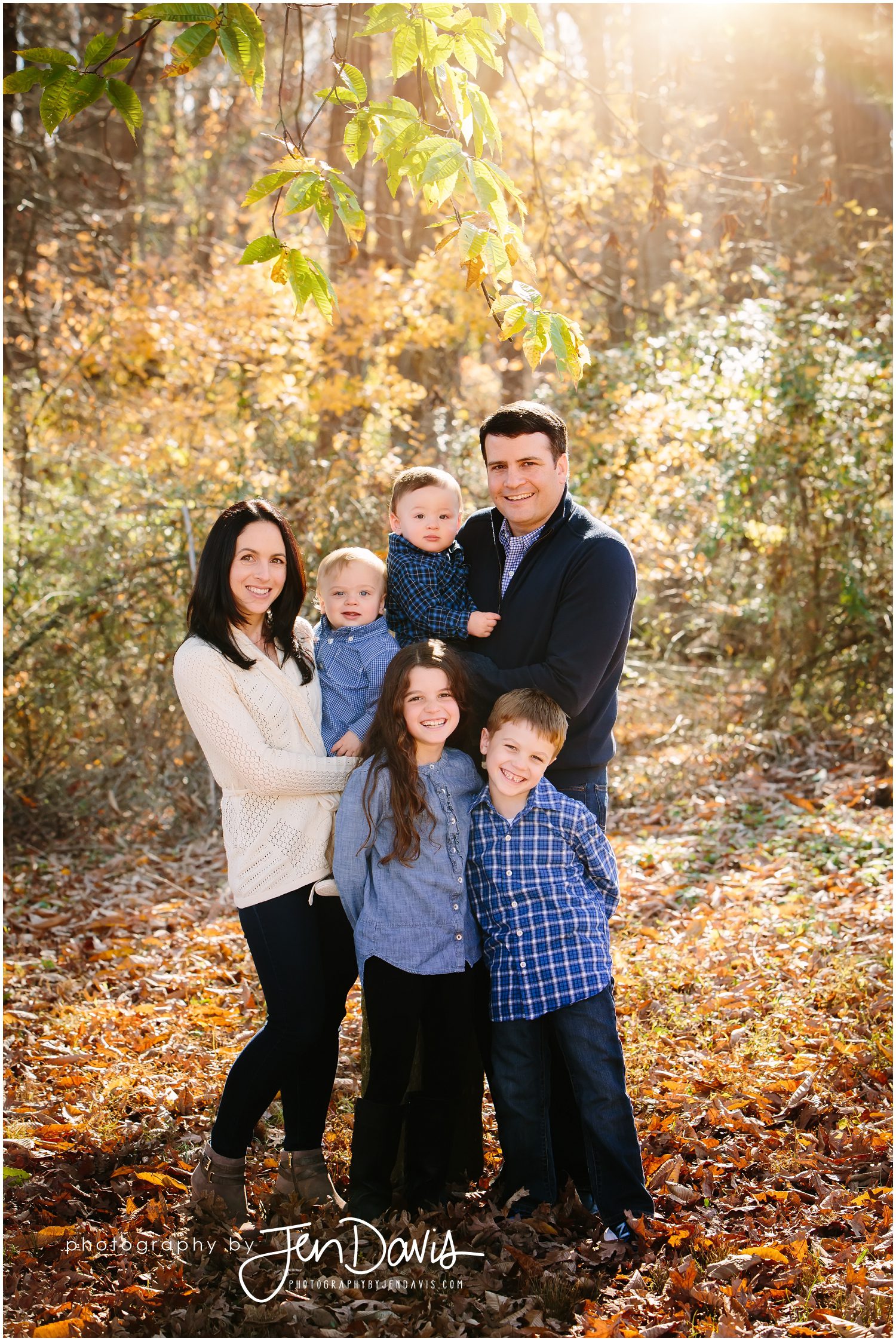 Family of 6 standing in the leaves