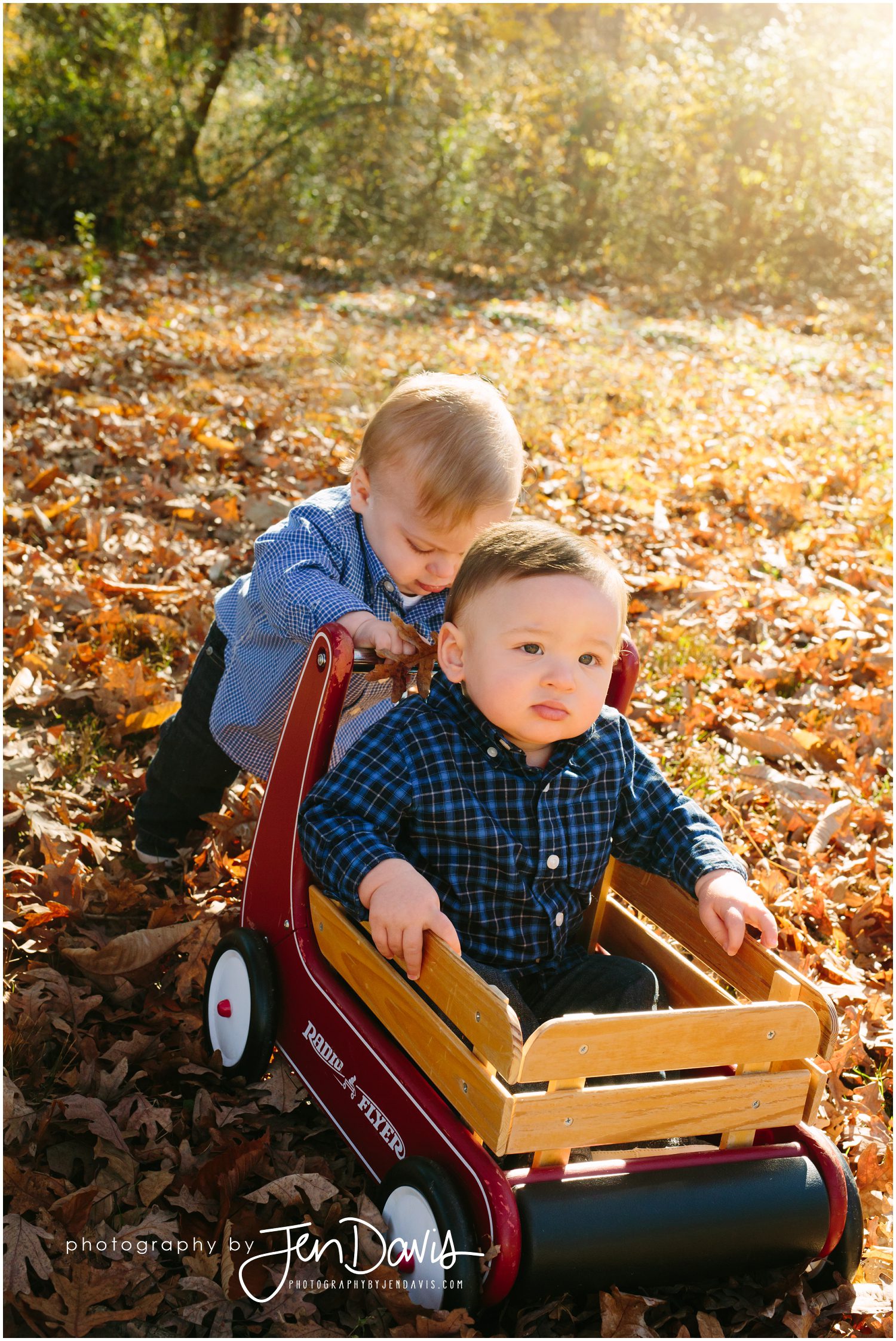 twins pushing each other in the wagon