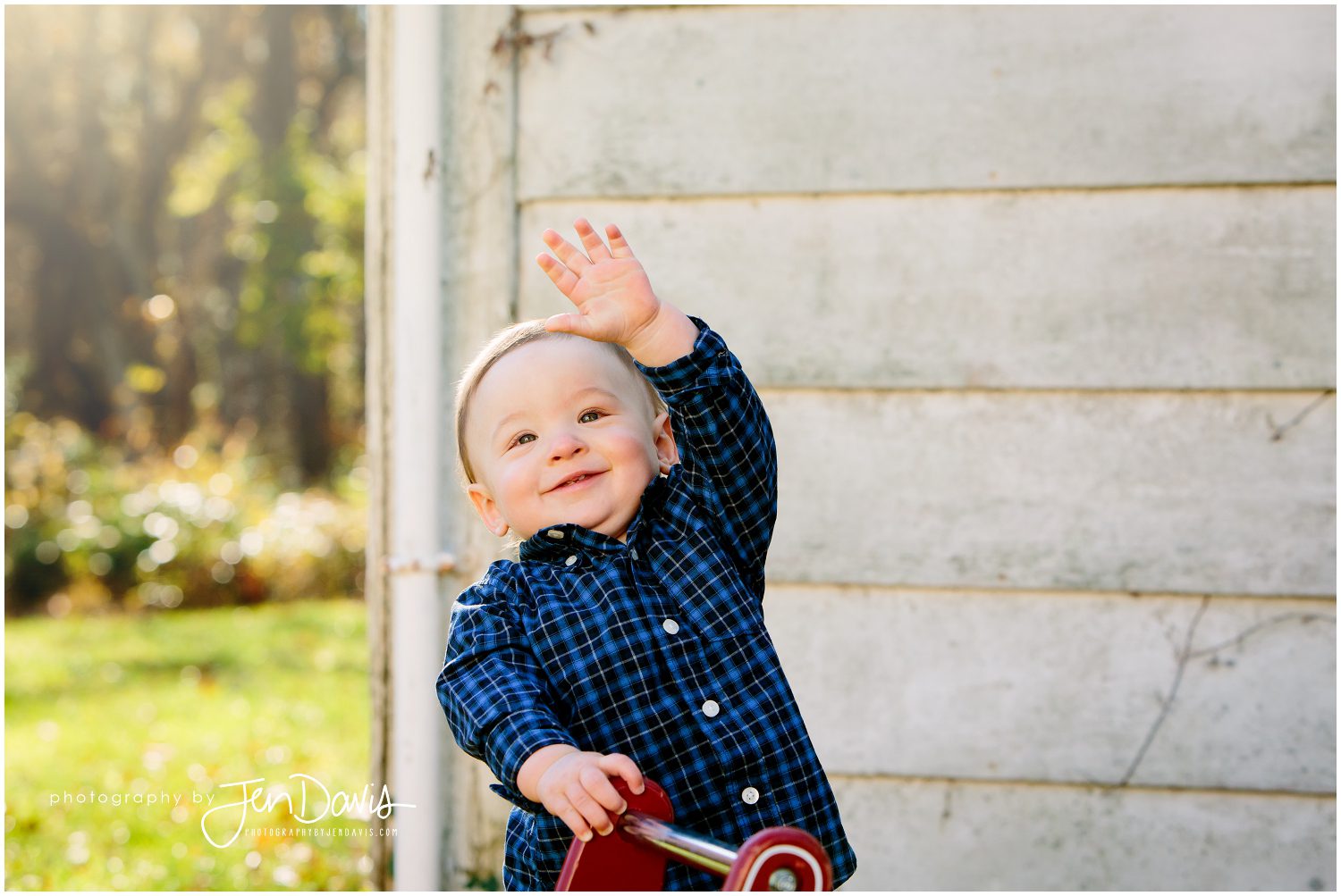 1 year old boy waving