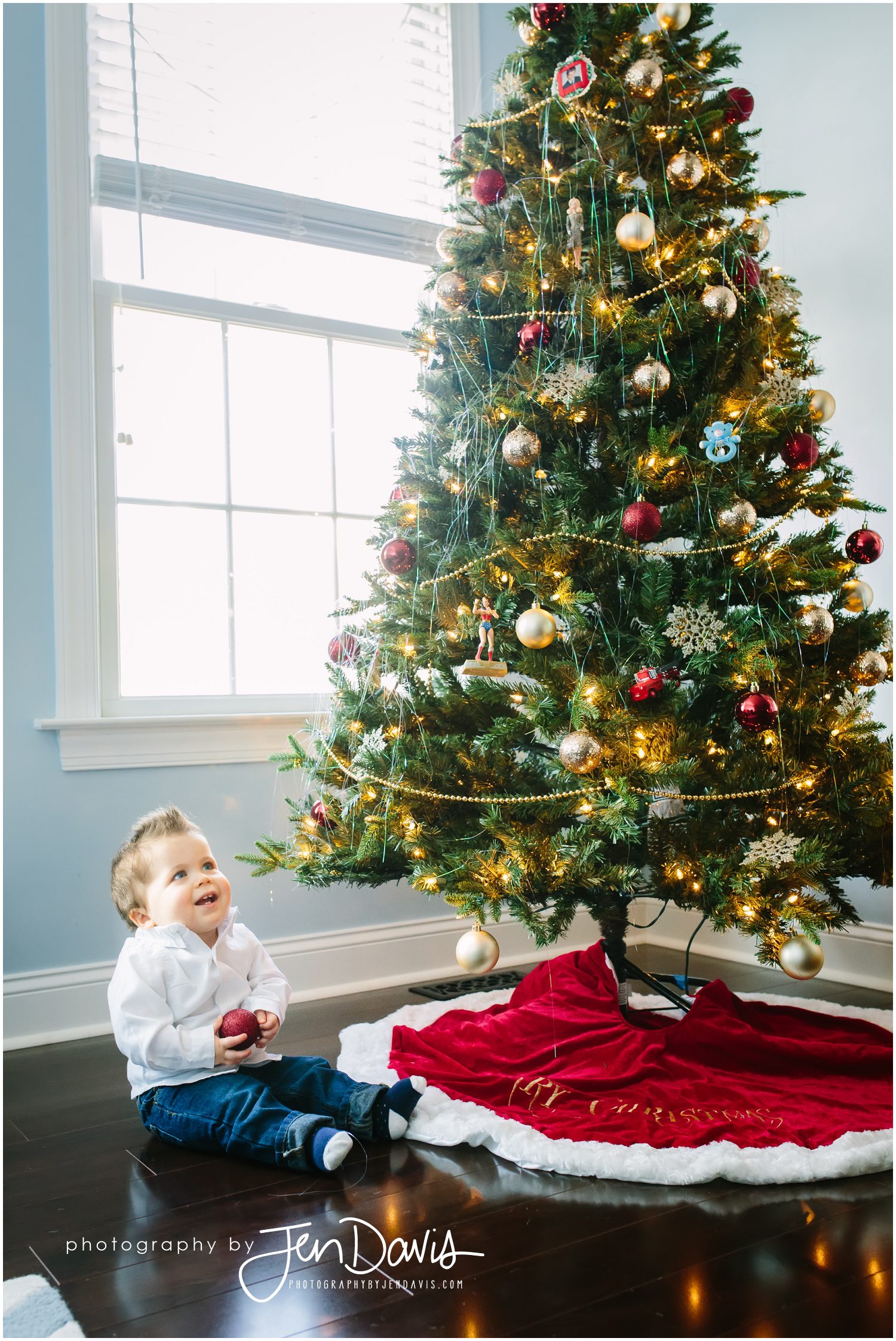 1 year old by christmas tree