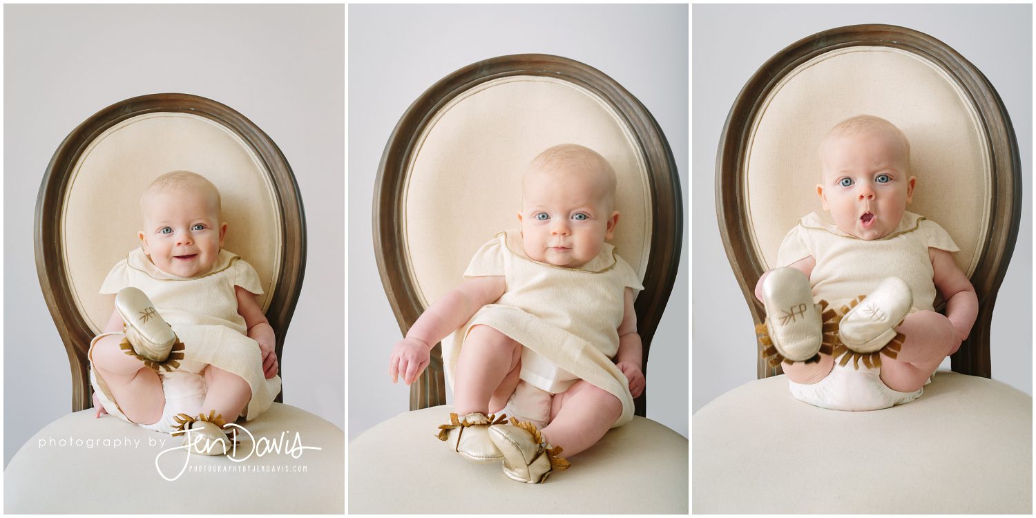 5 month old baby smiling and sitting in chair