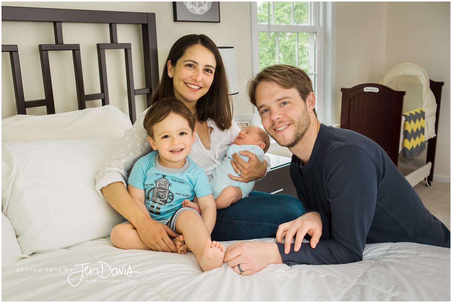 Newborn baby at home with family
