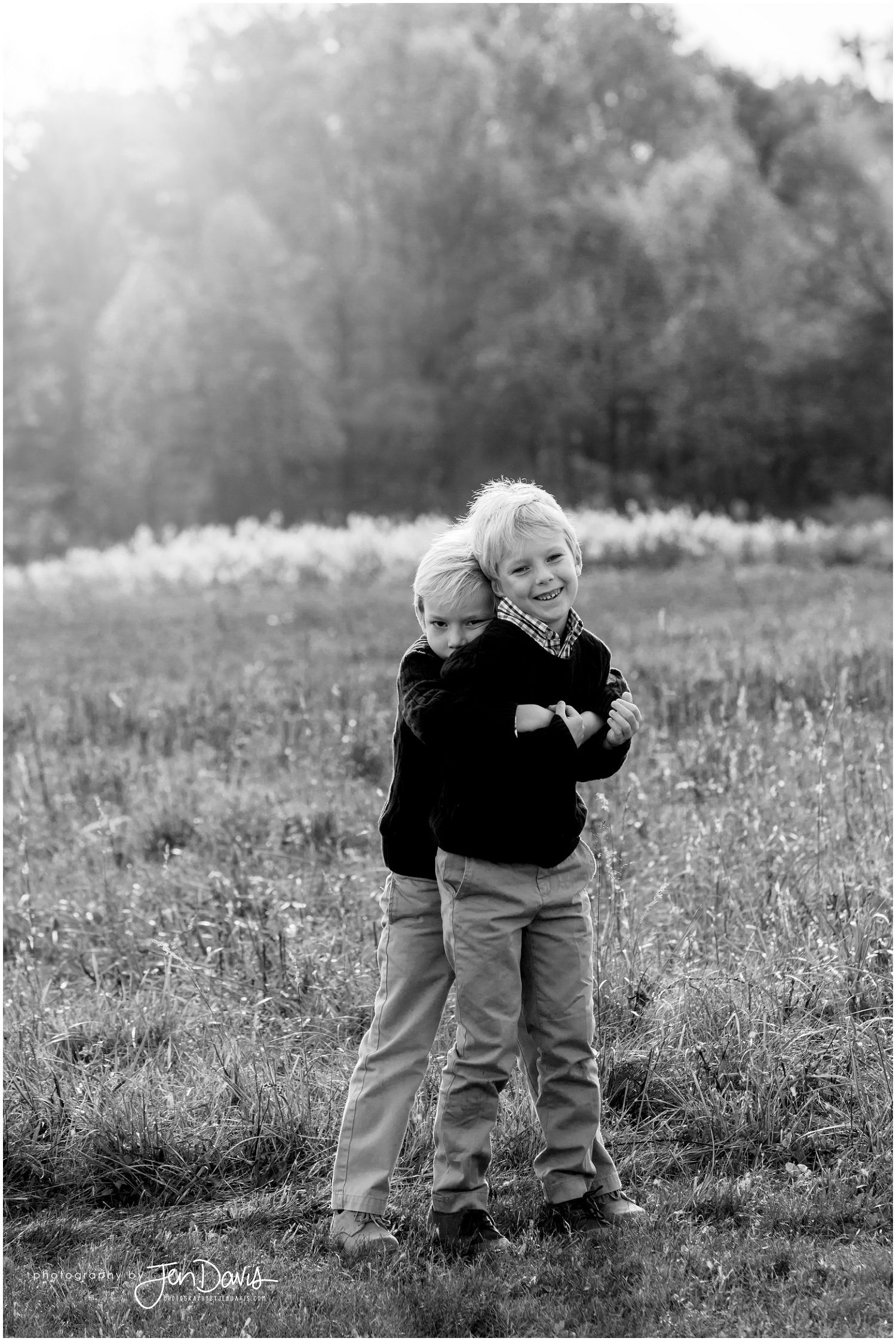 Siblings playing in a meadow
