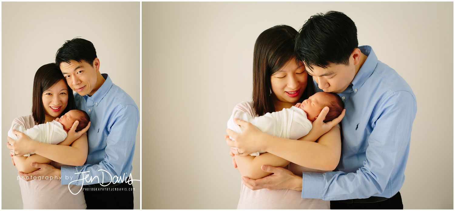 parents holding 13 day old baby girl