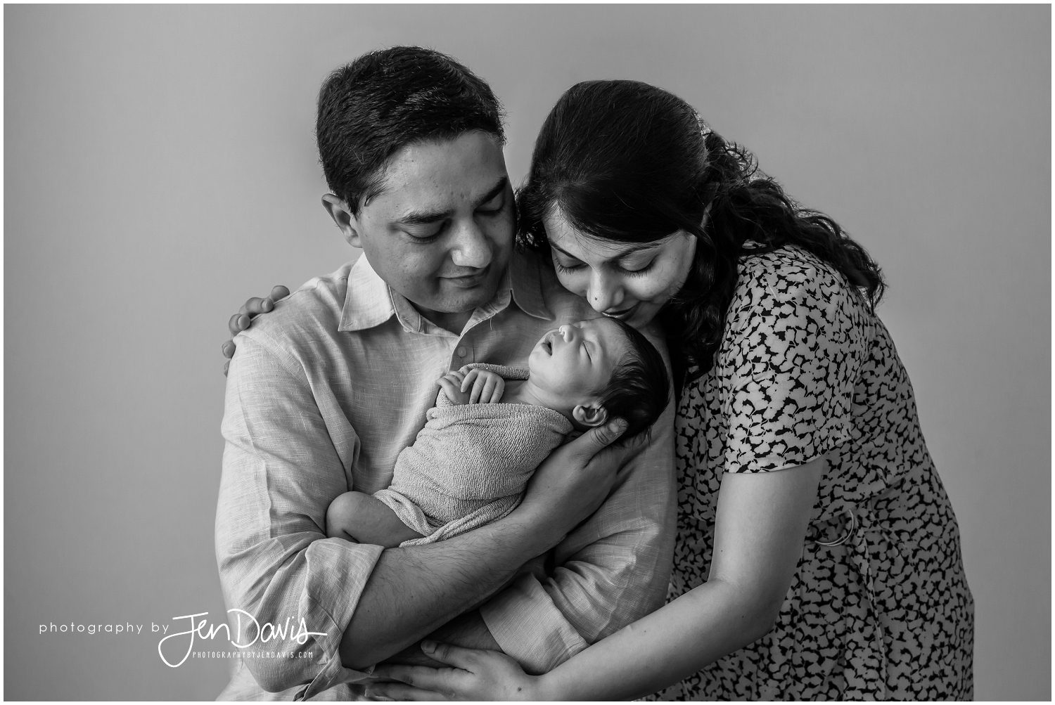 black and white baby picture with Mom and Dad